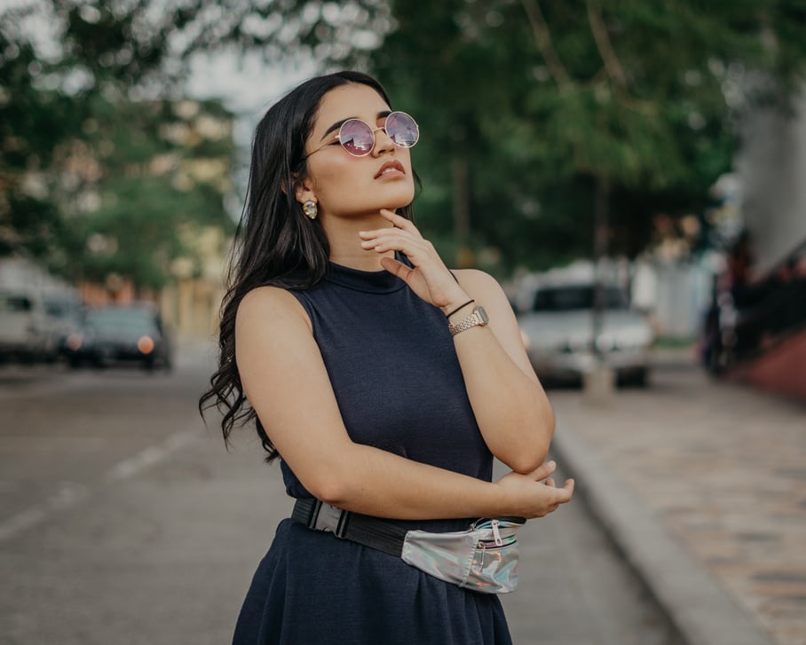 Women's Brown Sunglasses and Black Sleeveless Dress